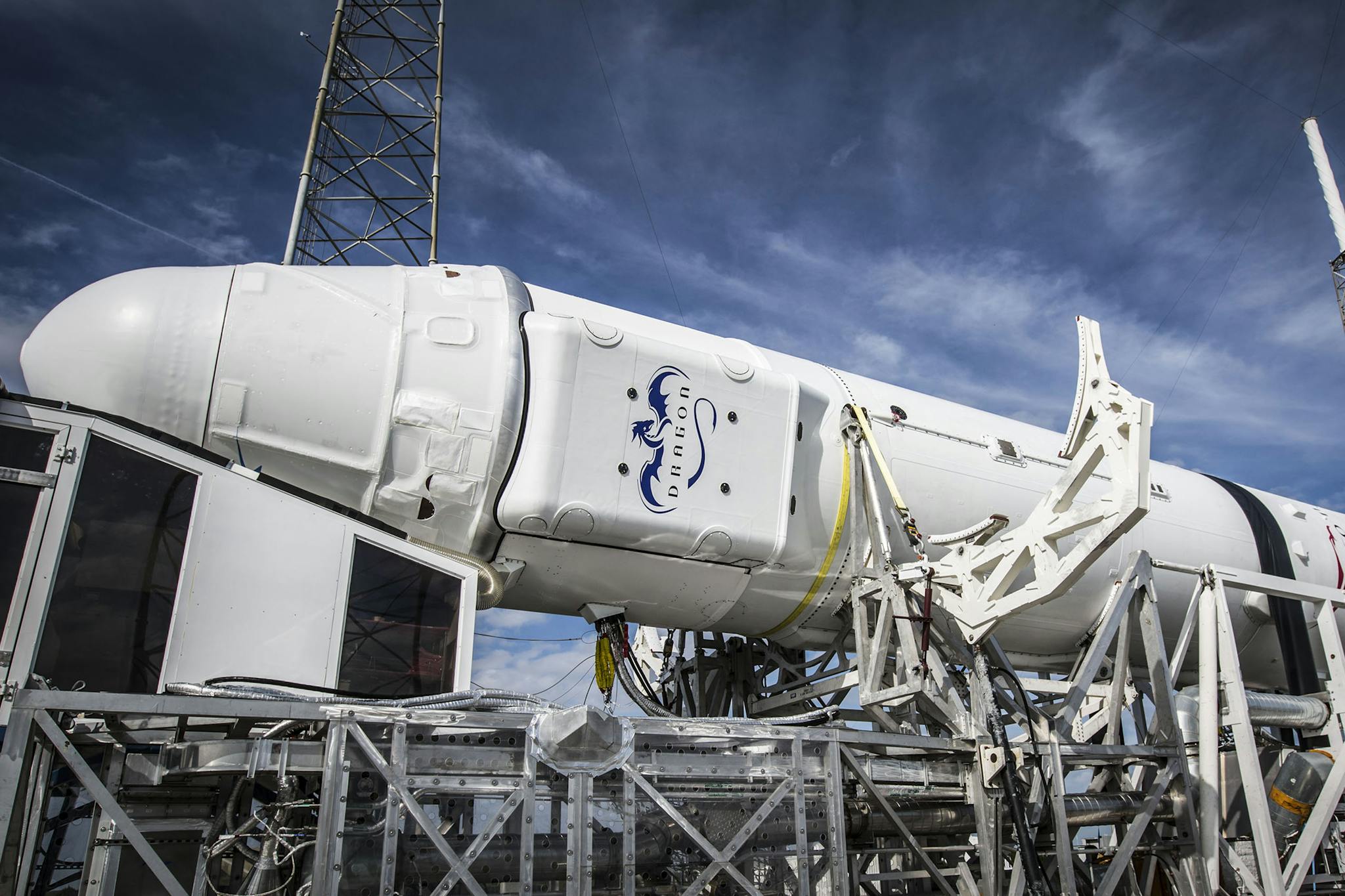 Low angle of solid rocket booster placed on industrial machine platform for transportation and installation against blue sky